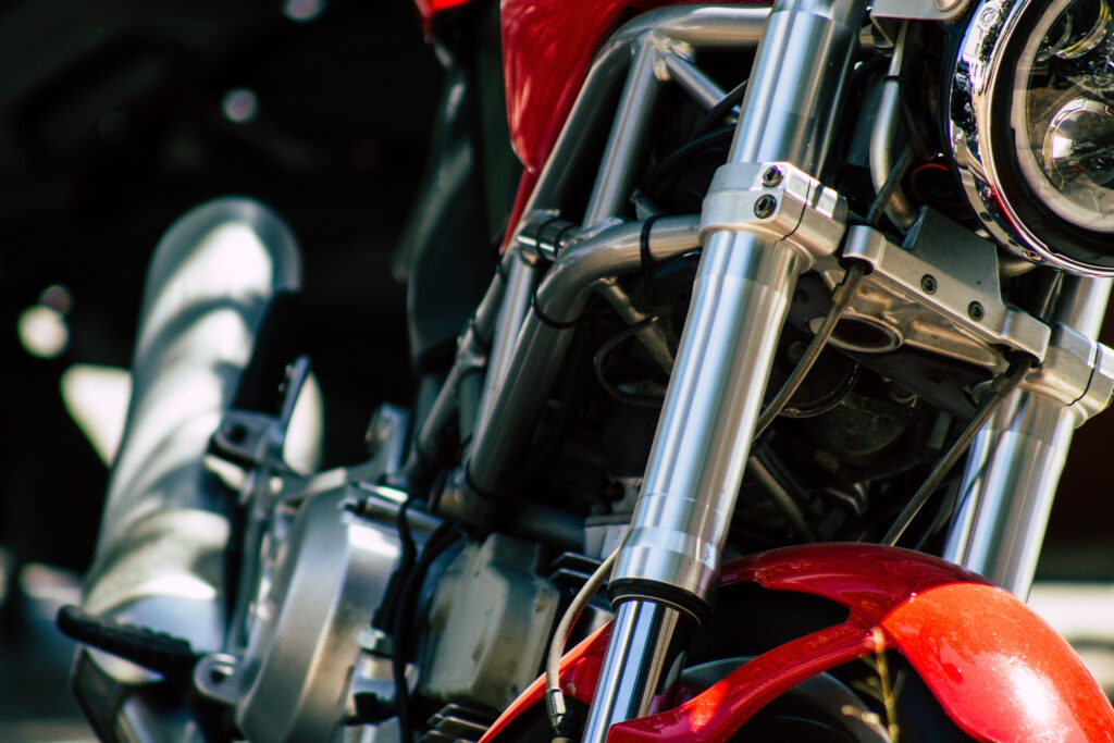 Closeup of a motorcycle rolling in the streets of the city center of the metropolitan area